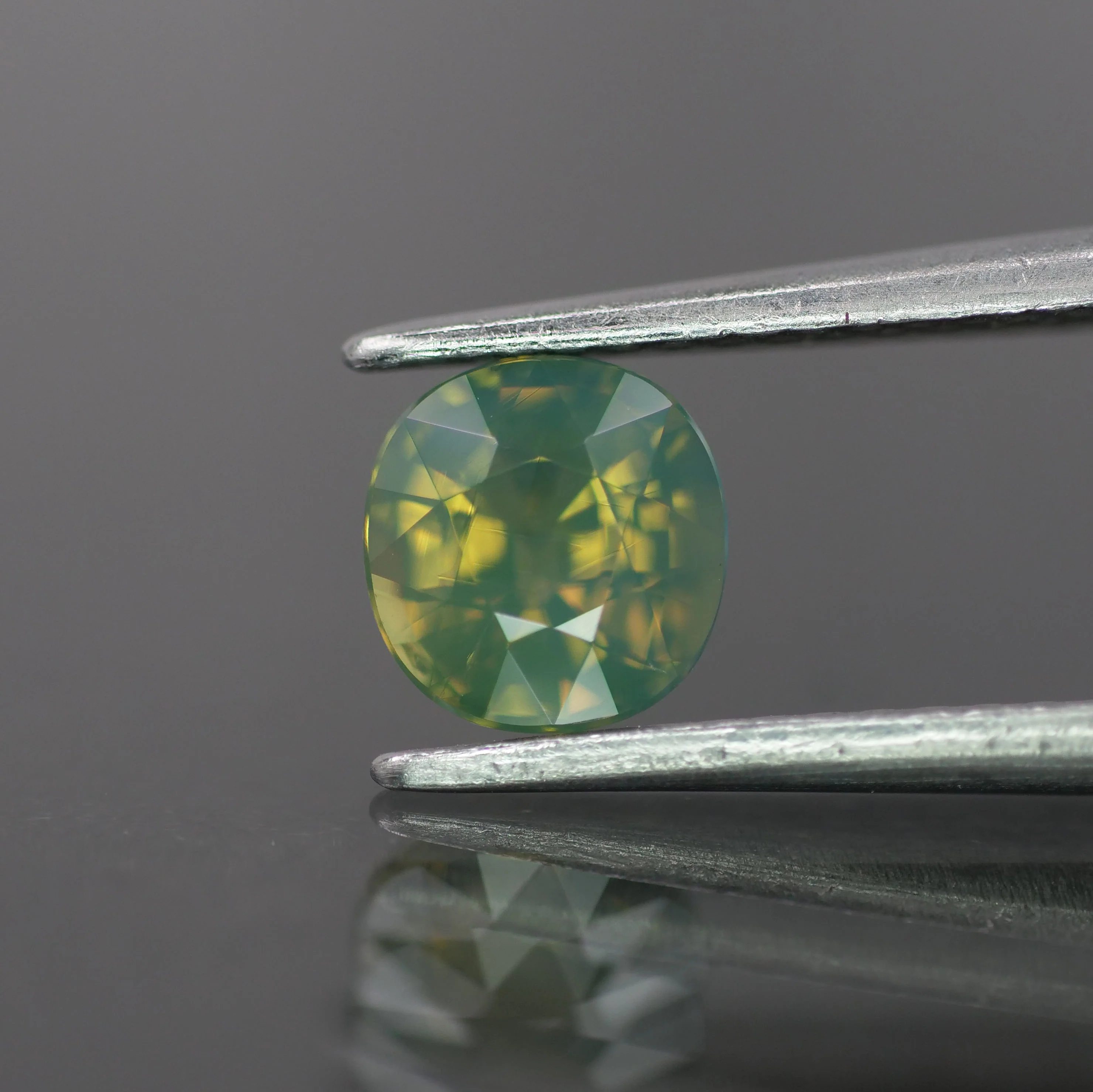 Opalescent Sapphire | natural, hazy waves: yellowish green color, cushion-cut, *5.5mm, 1ct, Madagascar