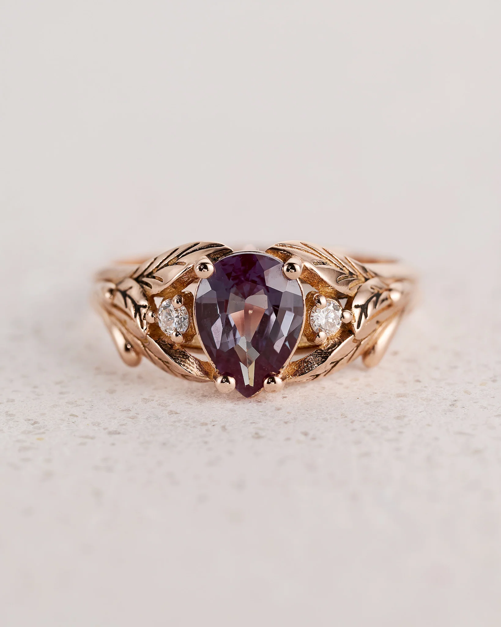 Alexandrite and diamonds engagement ring in a leafy setting / Wisteria
