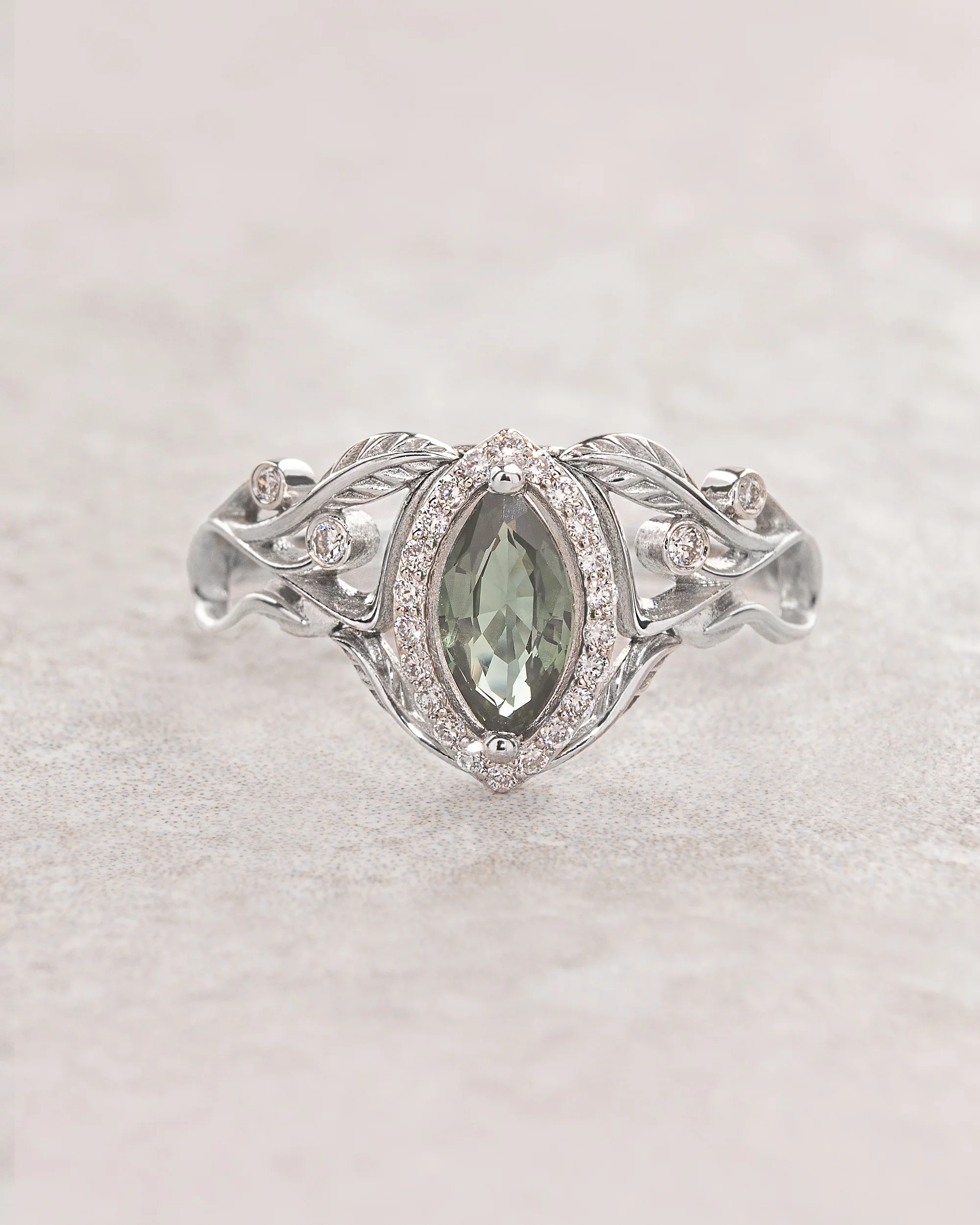 Marquise cut green sapphire engagement ring with diamond halo / Callisto
