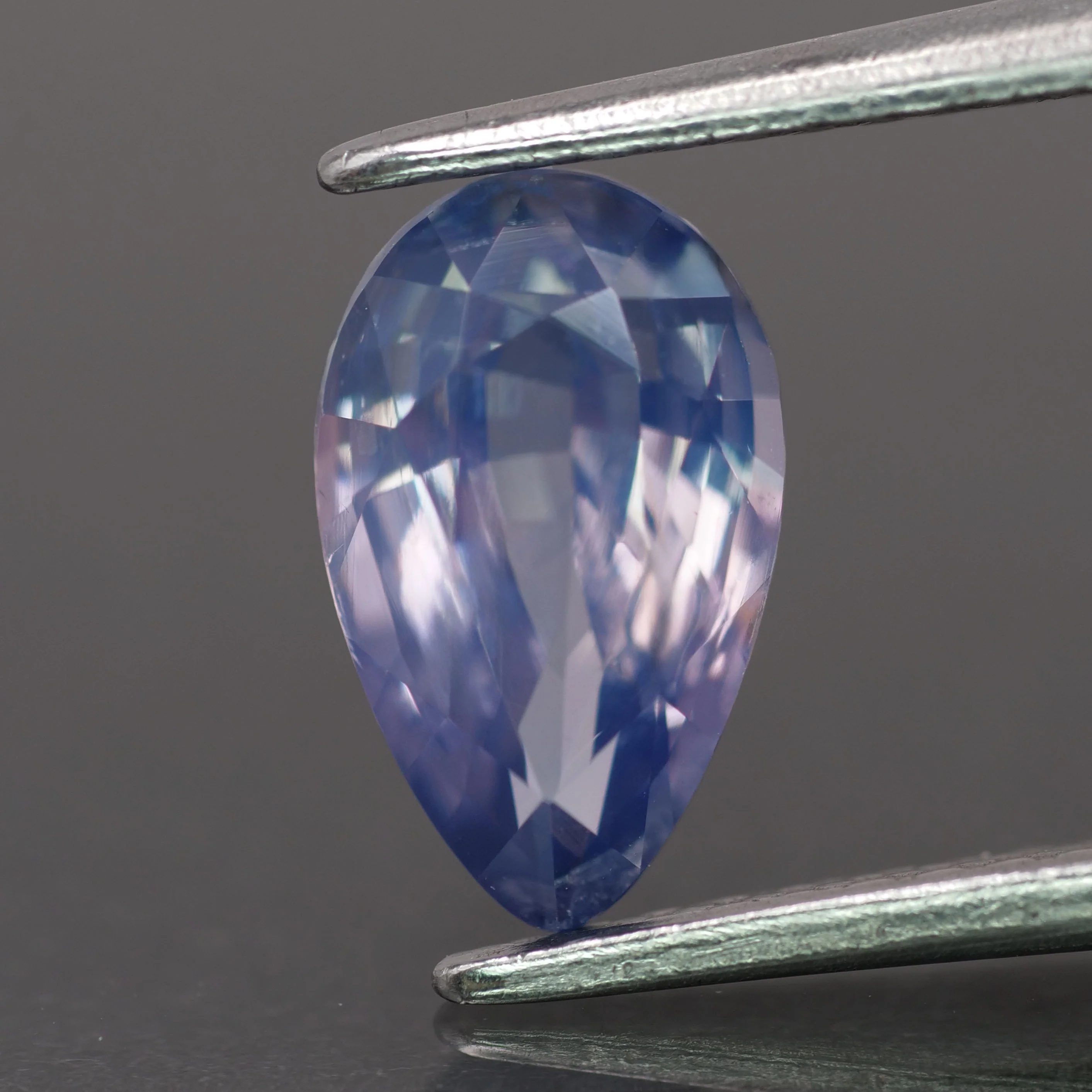 Opalescent sapphire | natural, greyish purple color, pear-cut, *9x5.5mm, 1.4ct