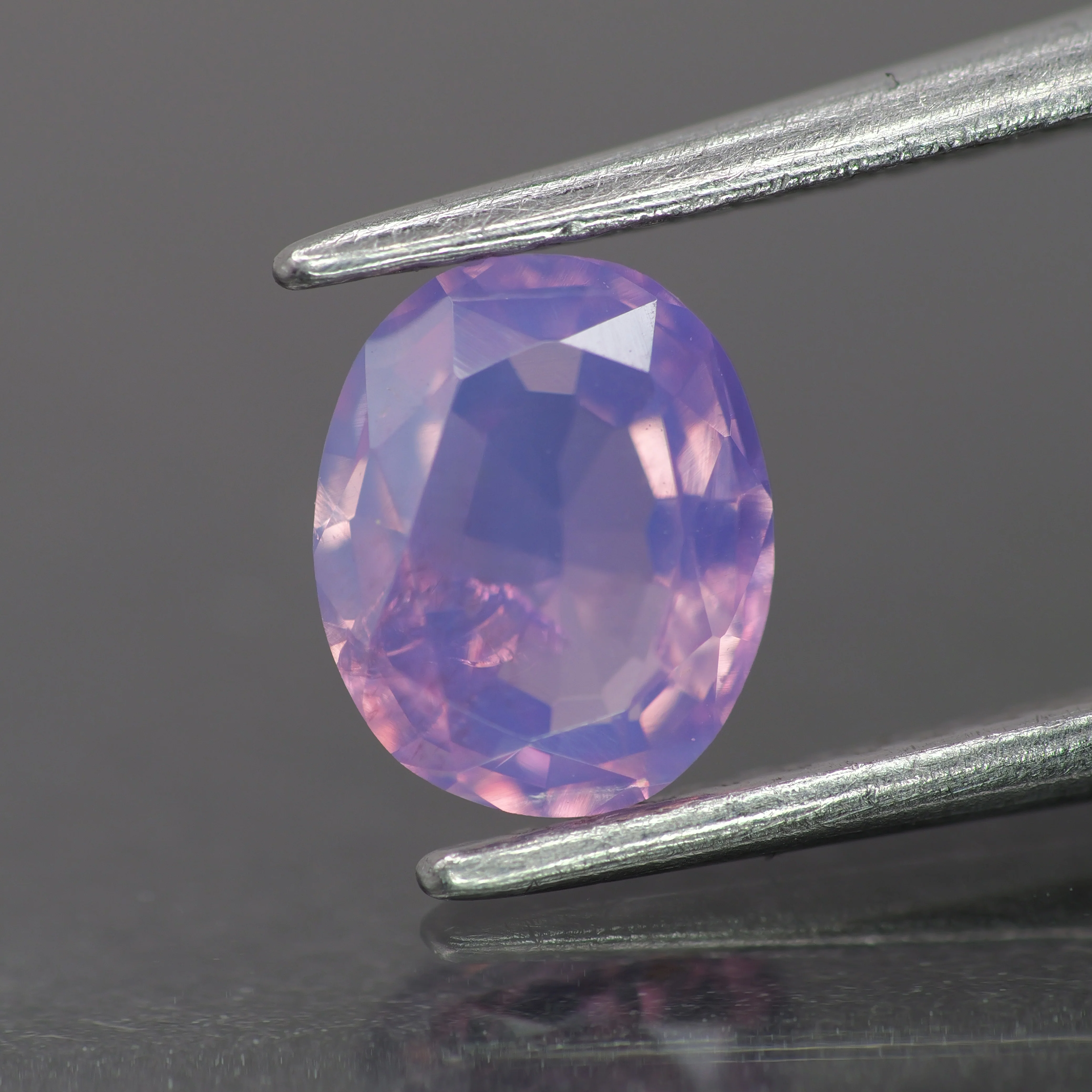 Opalescent sapphire | natural, pinkish purple color, oval-cut, *7x5mm, *0.8ct