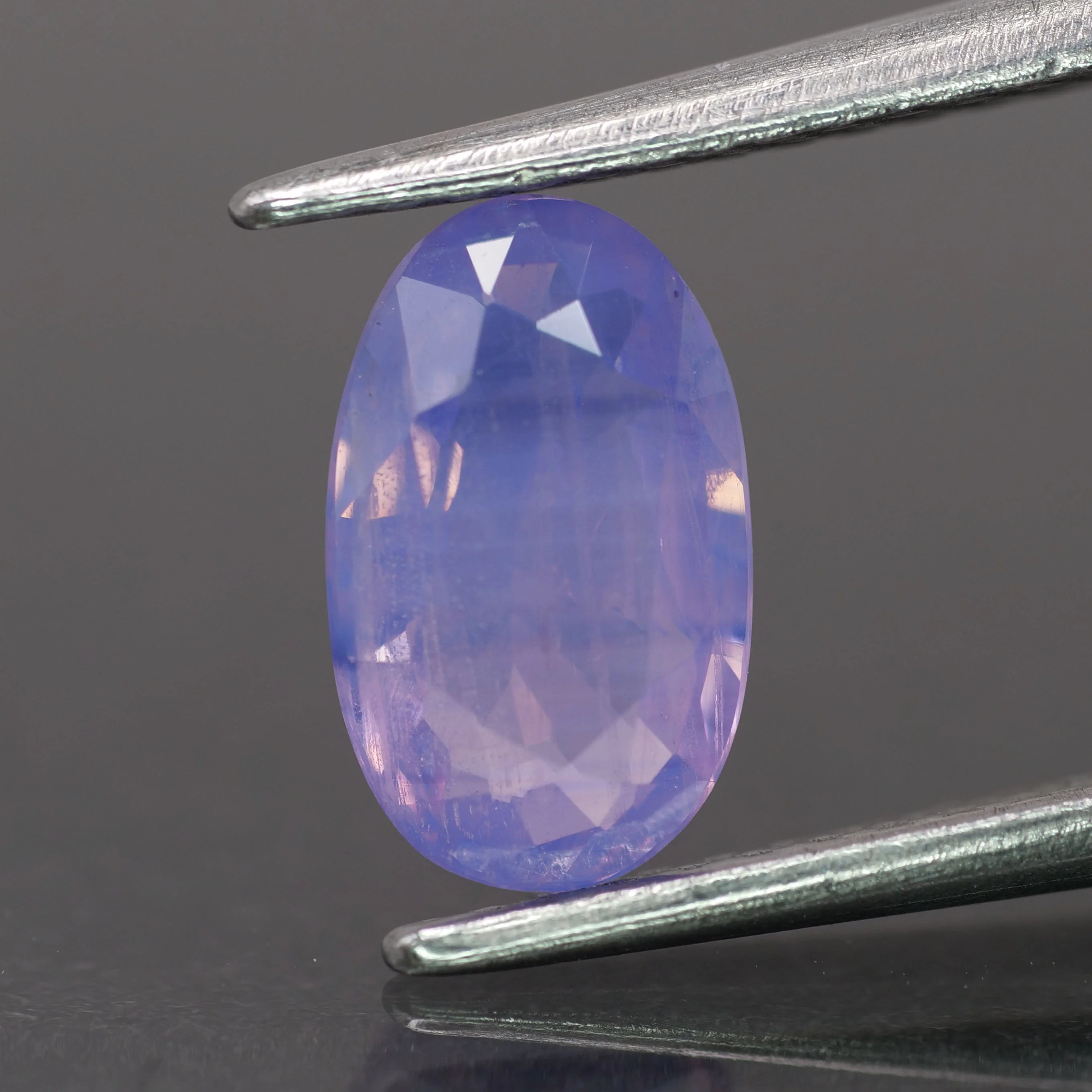 Opalescent sapphire | natural, pinkish purple color, oval-cut, *8x5mm, 1ct