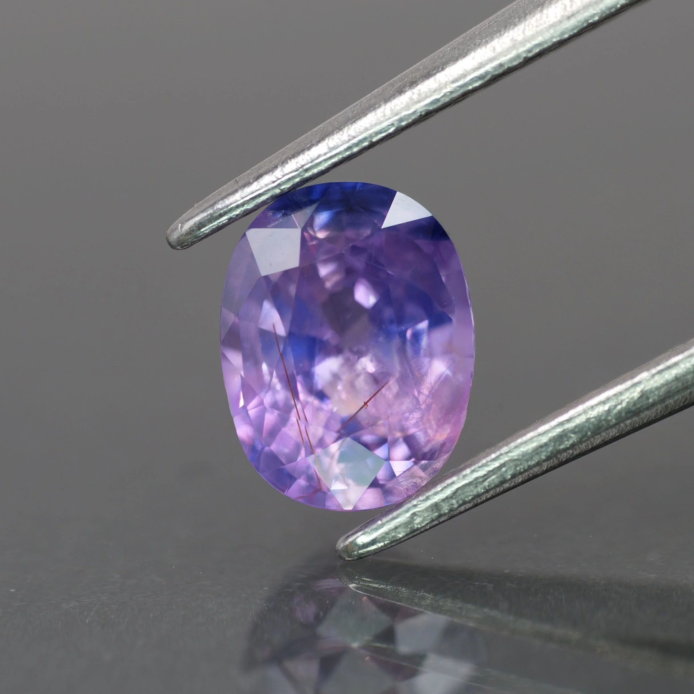 Opalescent sapphire | natural, purplish pink color, oval-cut, *6.5x5mm, 1ct