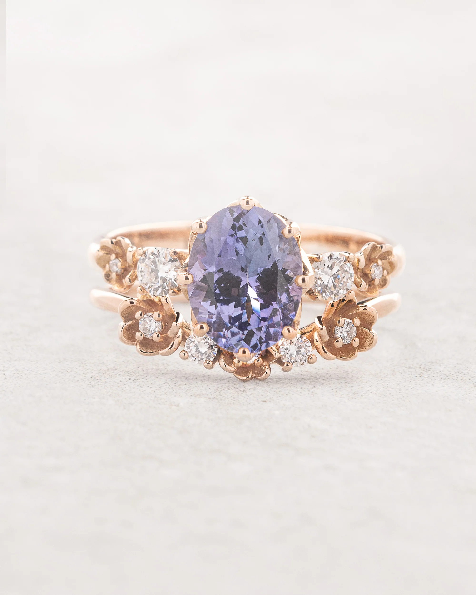 Purple tanzanite engagement ring set with a floral wedding band / Fiorella