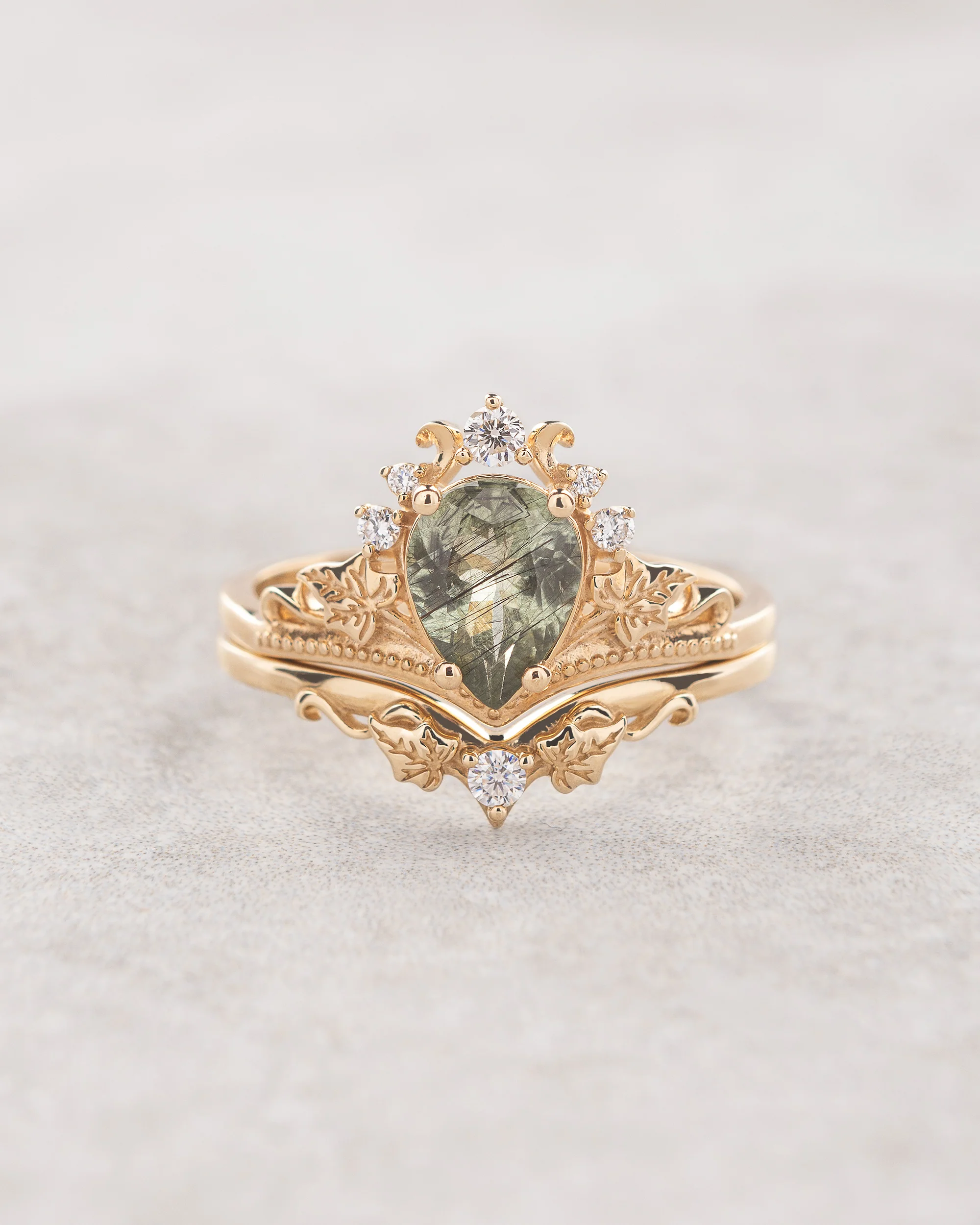 Rutile peridot engagement ring set with a matching wedding band / Ariadne