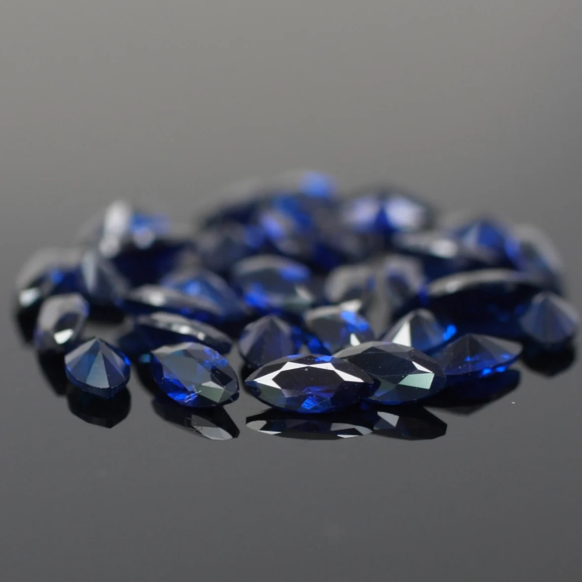 Sapphire | lab-grown, dark blue color, marquise-cut, accent stones