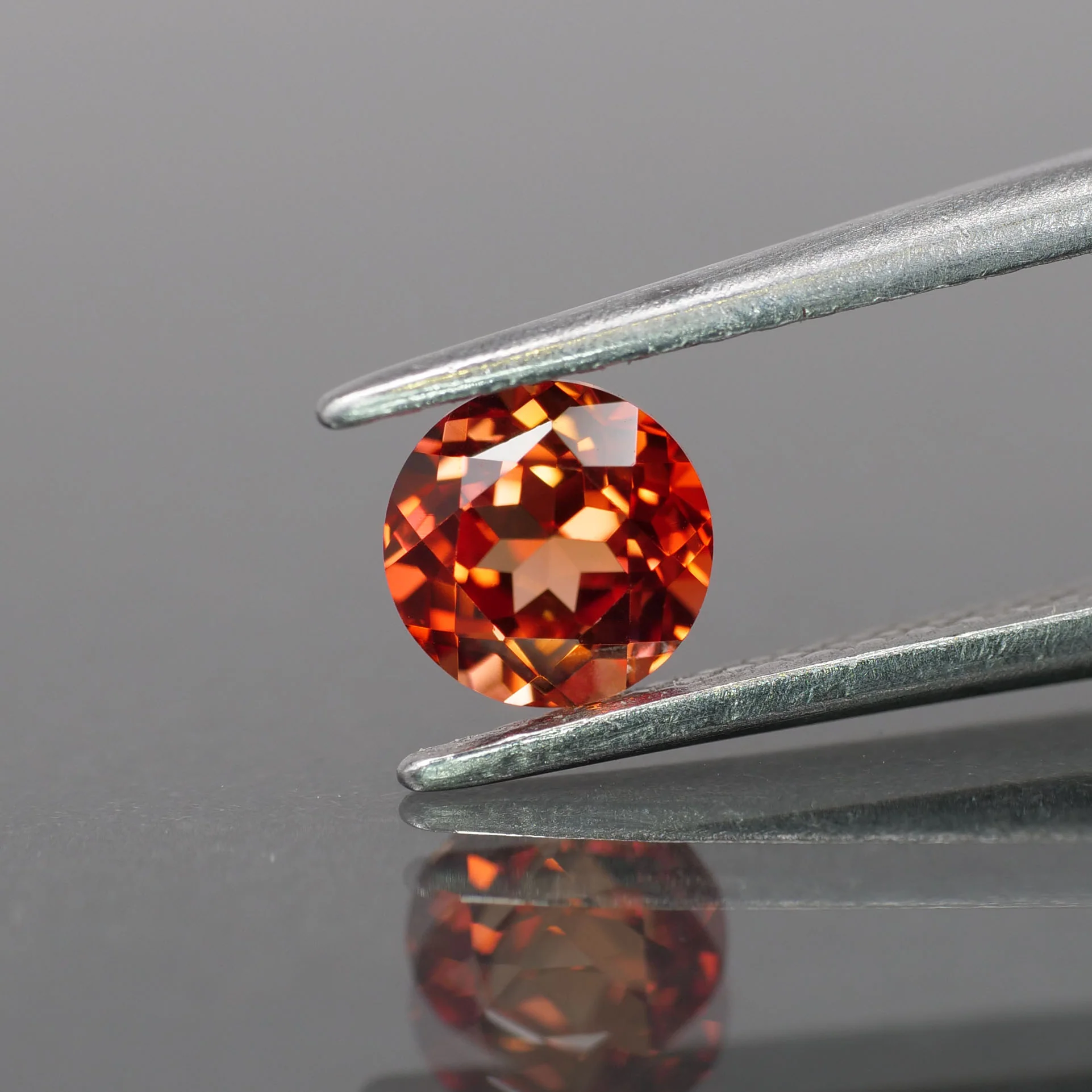 Sapphire | lab-grown, orange padparadscha color, round-cut, 5mm, 0.6ct