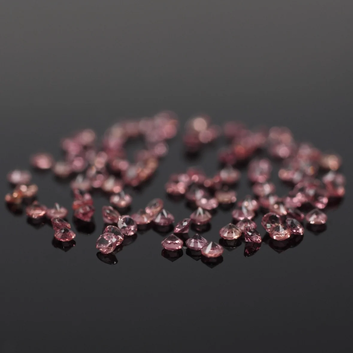 Sapphire | natural, light padparadscha color, round-cut, accent stones