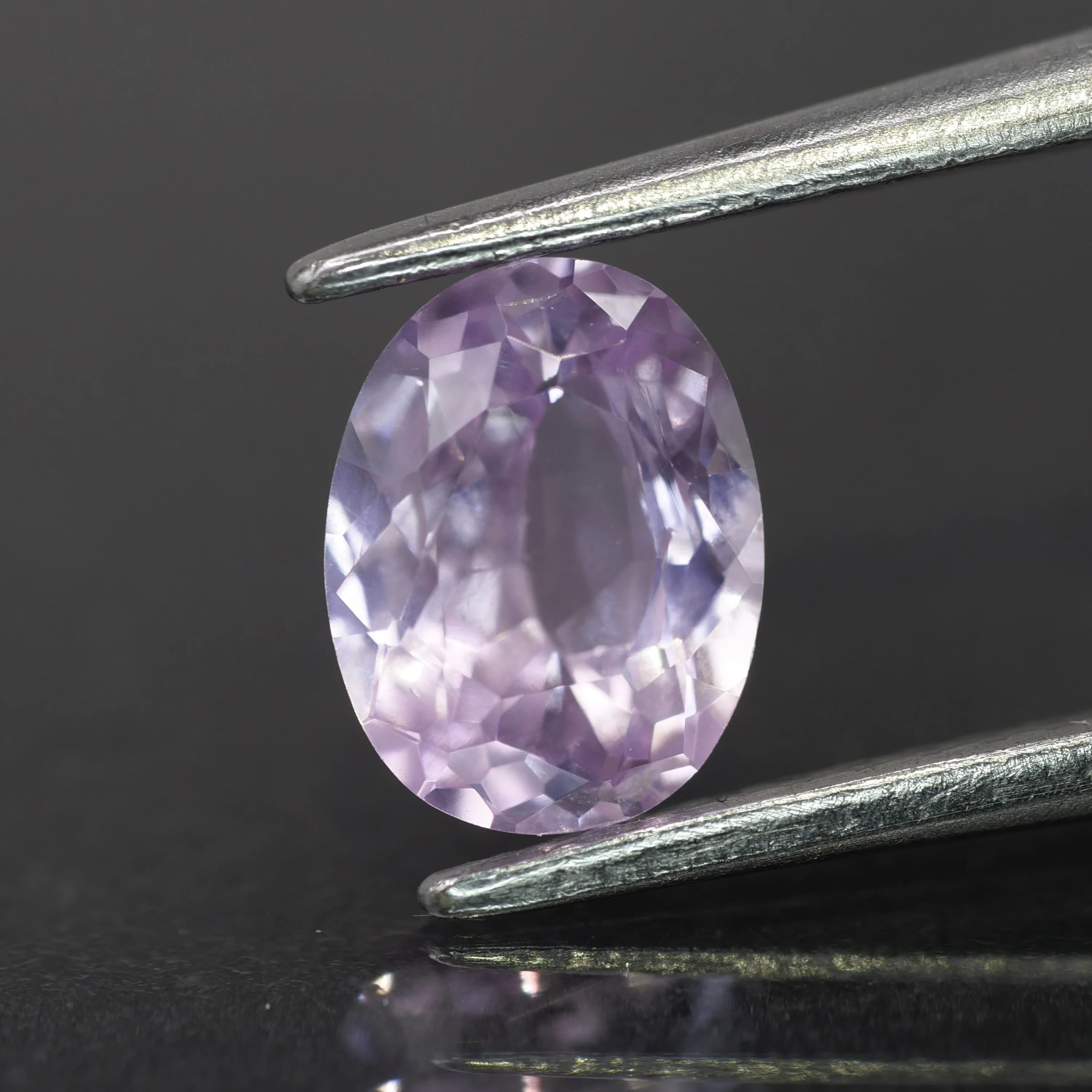 Sapphire | natural, light purplish pink color, oval-cut, *7x5mm, 0.9ct