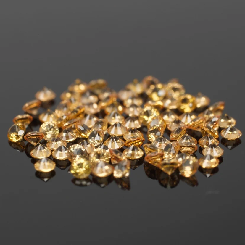 Sapphire | natural, orange color, round-cut, accent stones