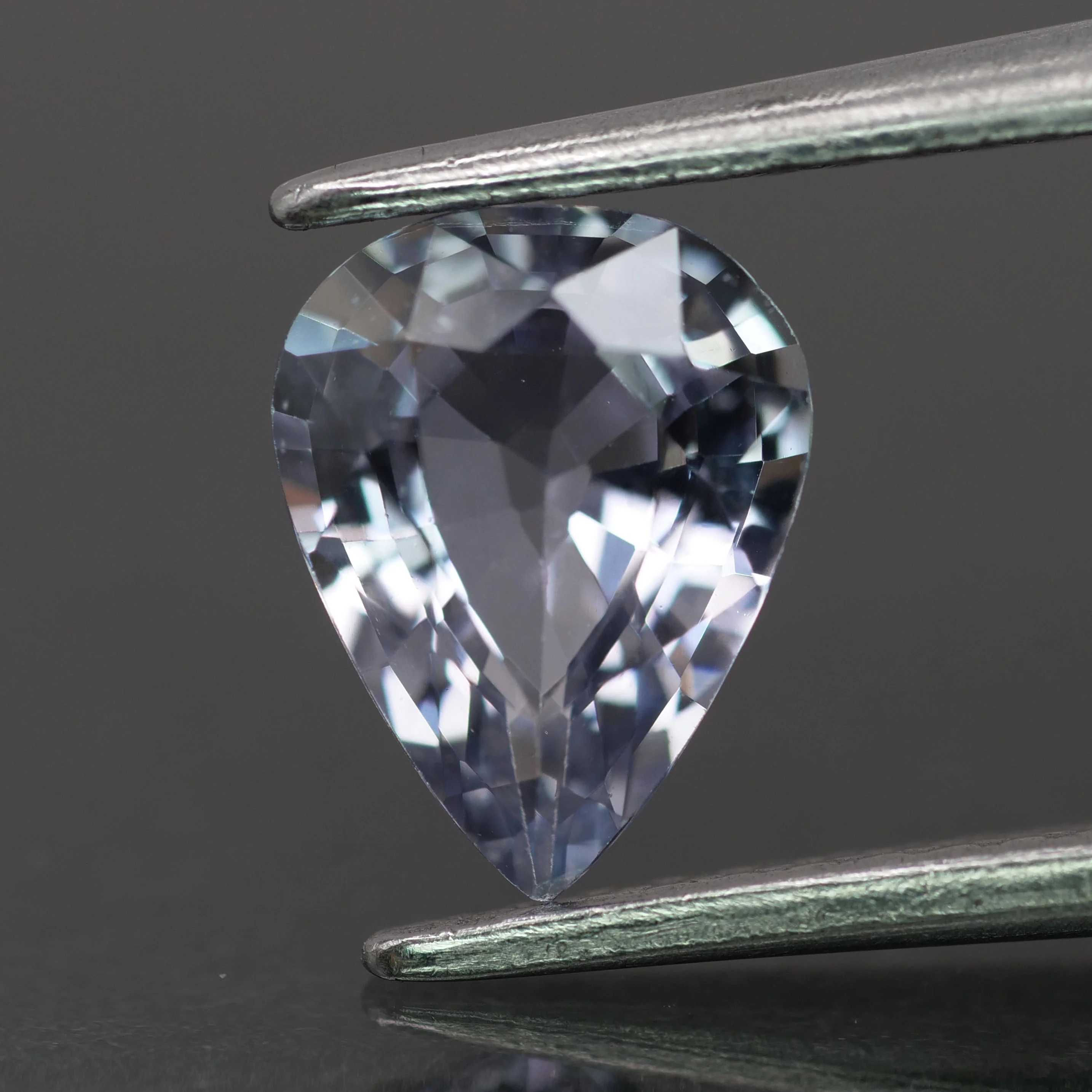 Sapphire | natural, purplish grey color, pear-cut, 8x6mm, 1.2ct