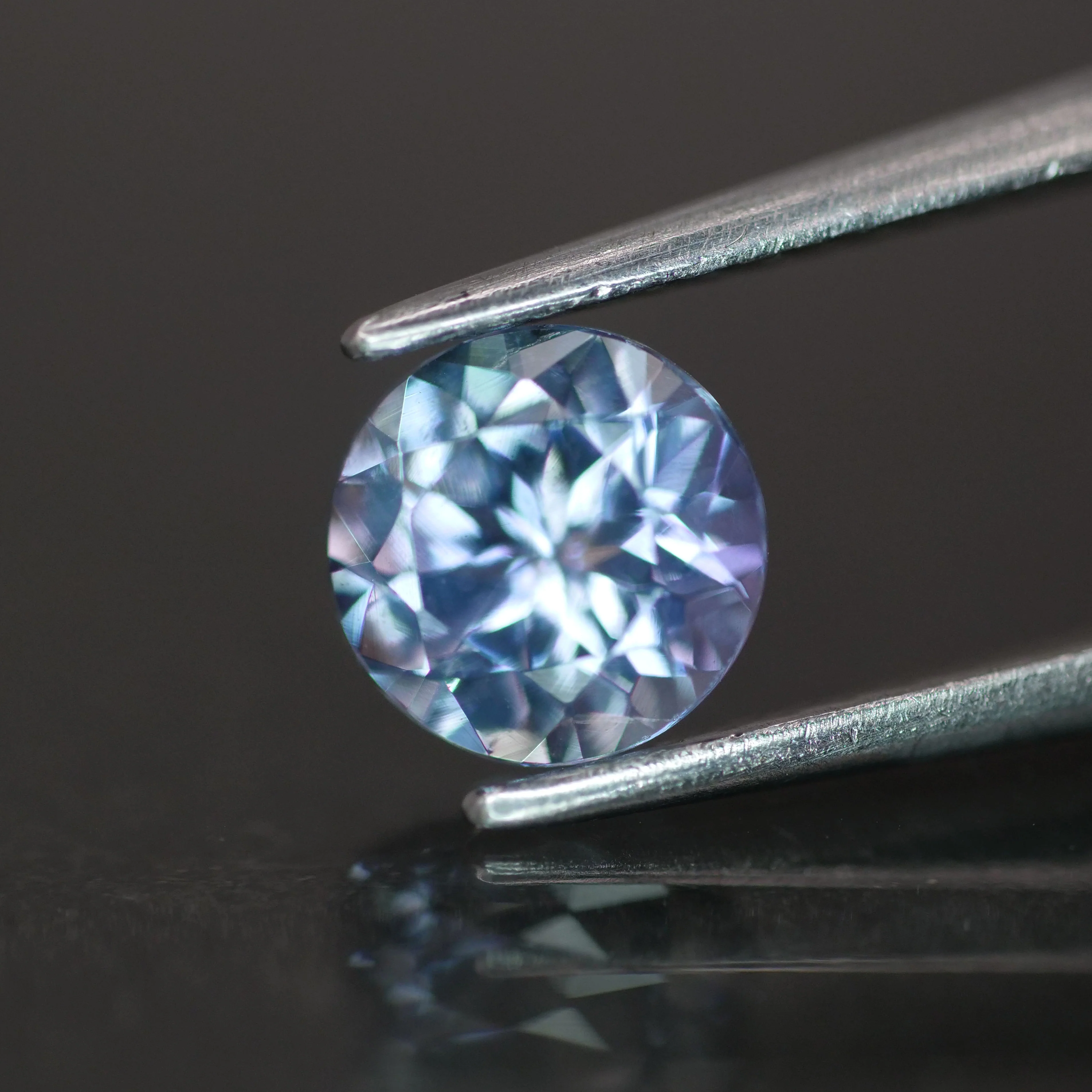 Tanzanite | natural, purplish blue color, round-cut, *6mm, 0.8ct