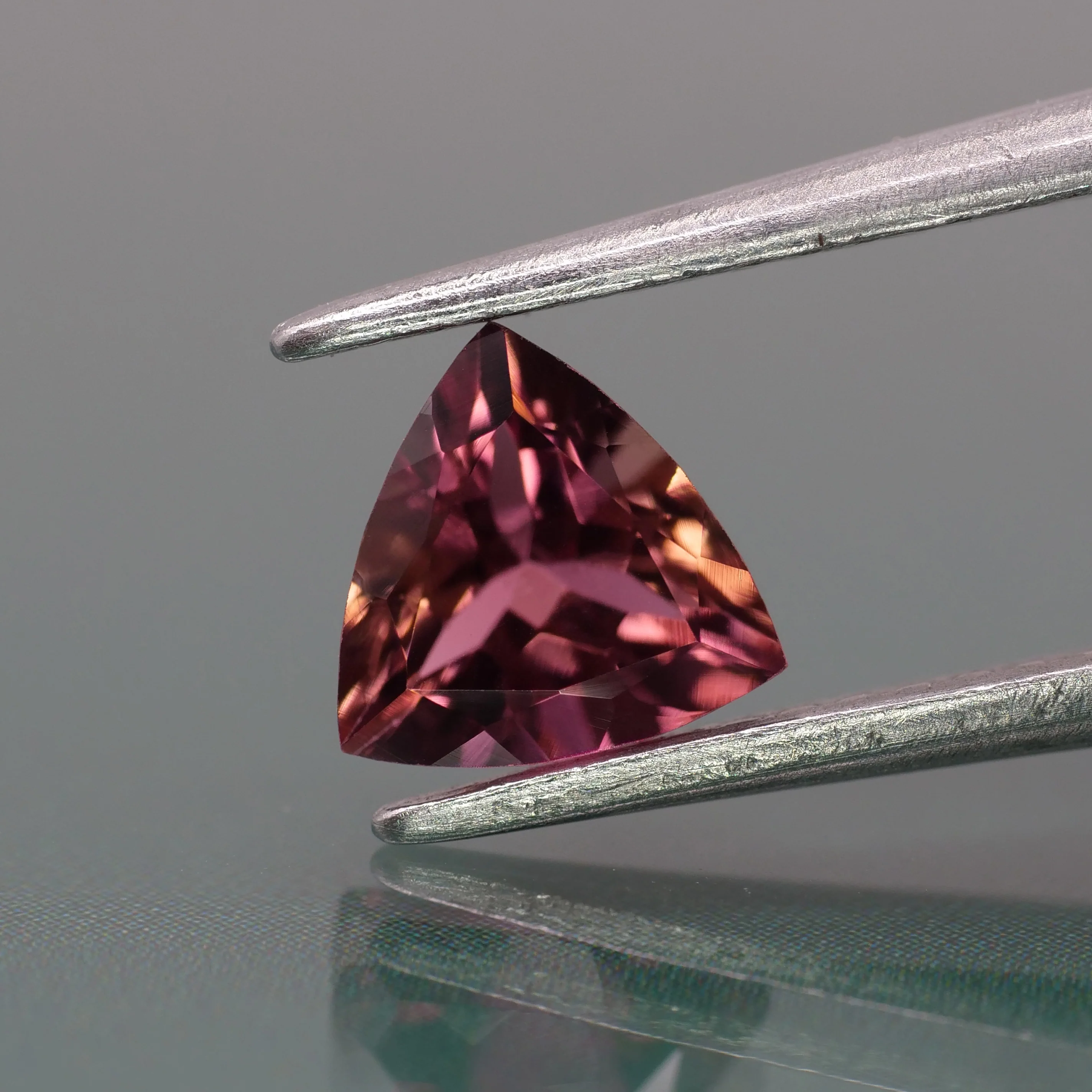 Tourmaline | natural, orangish pink color, trillion-cut, 6mm, 0.8ct